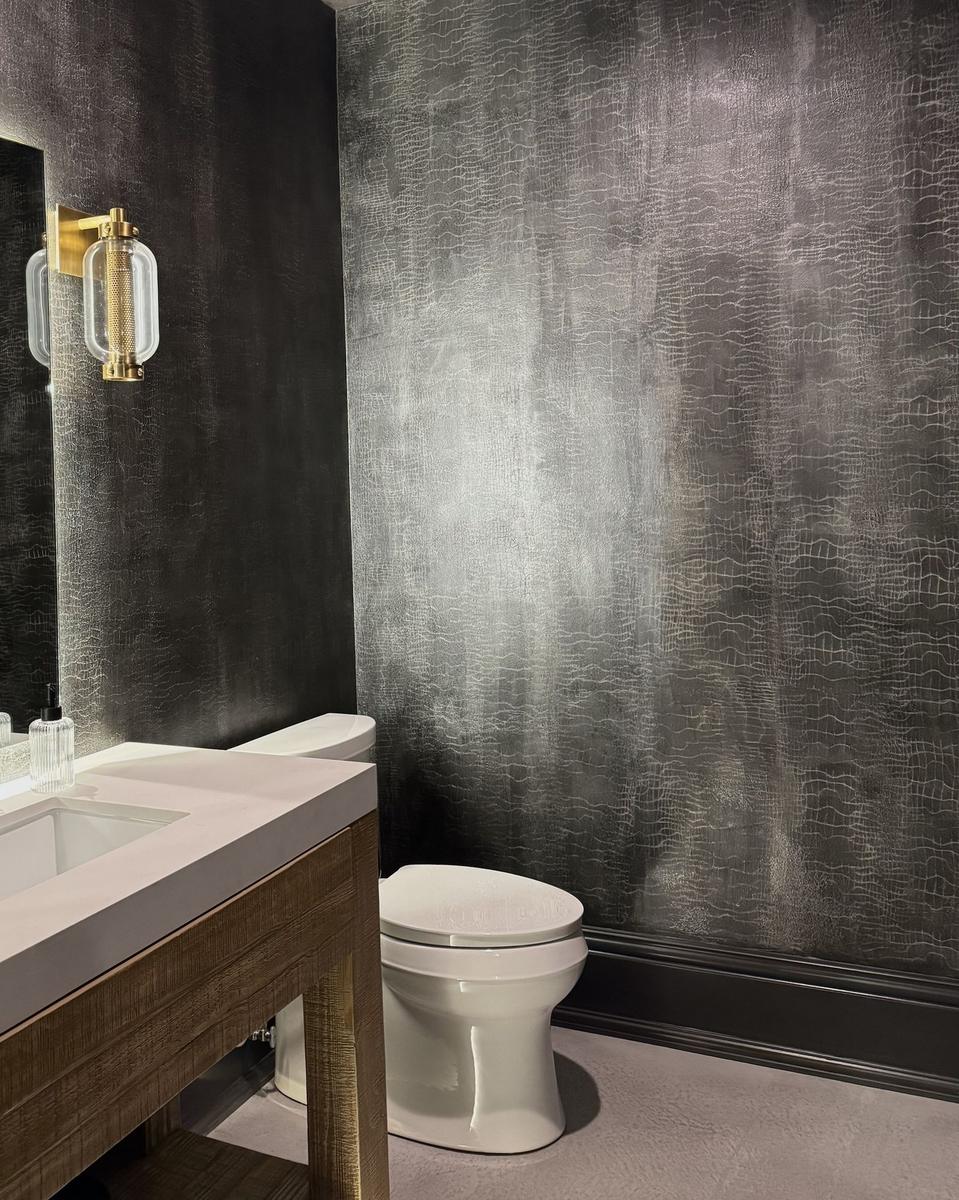 Black metallic crackle faux finish powder bath with brass sconce