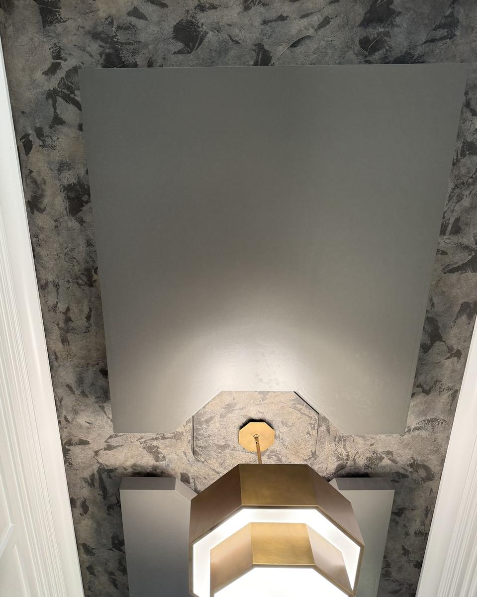 Faux-finished ceiling with painted panel and brass pendant